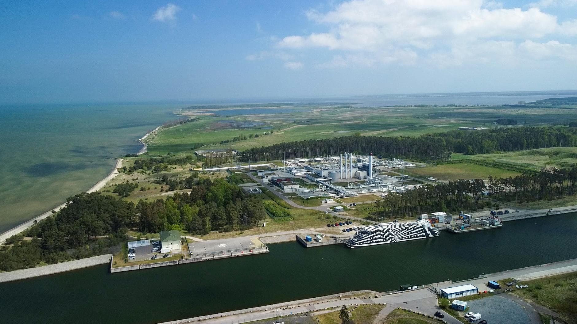 Breathtaking aerial view of Lubmin's industrial port and landscape, showcasing a coastal receiving station.