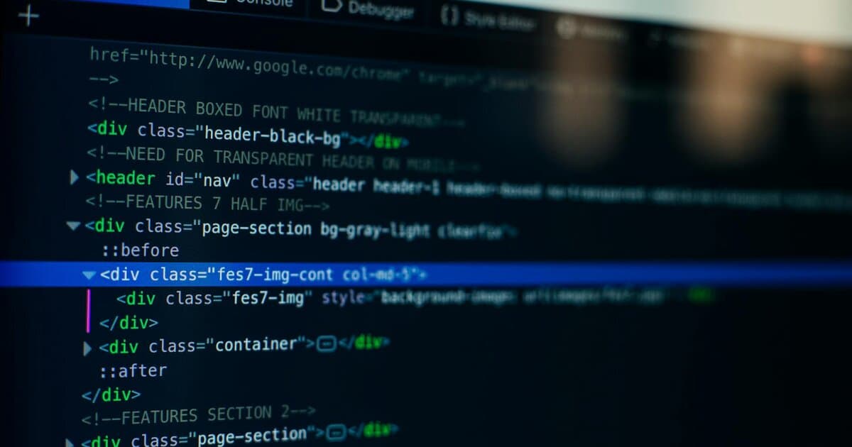 Detailed view of HTML code on a computer screen, ideal for tech and software development themes.