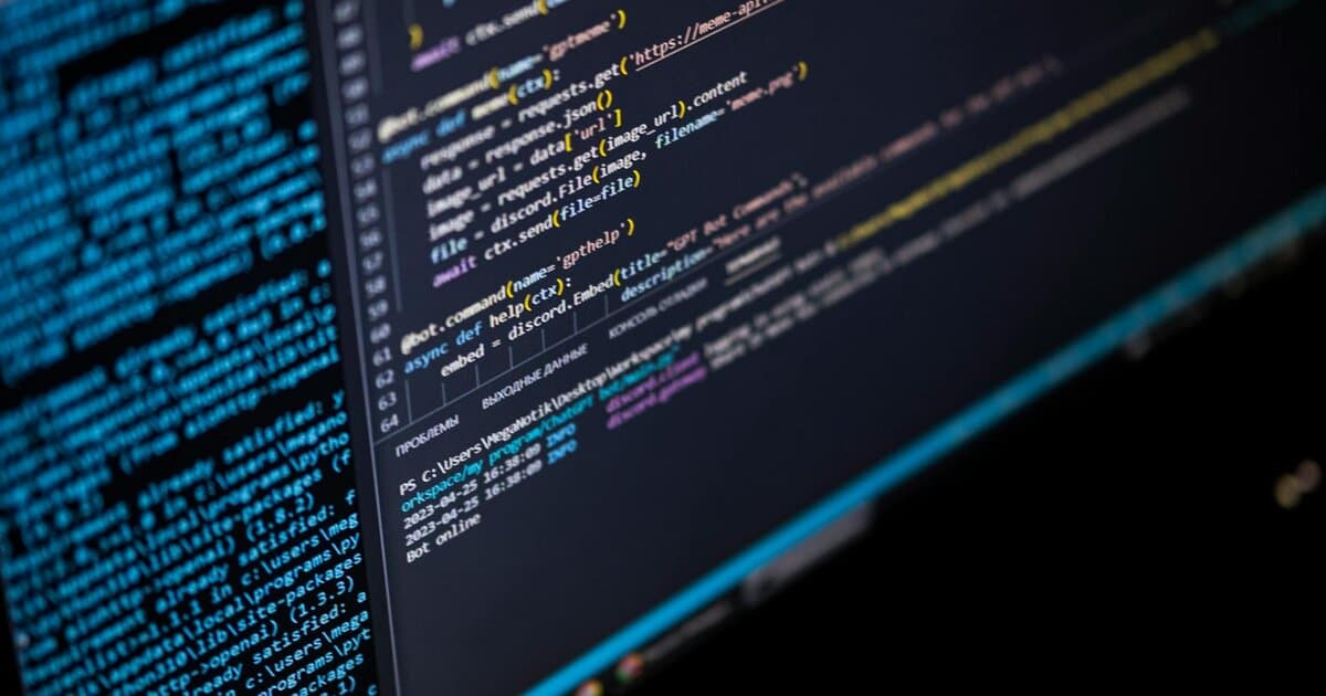 Close-up of a computer screen displaying HTML, CSS, and JavaScript code