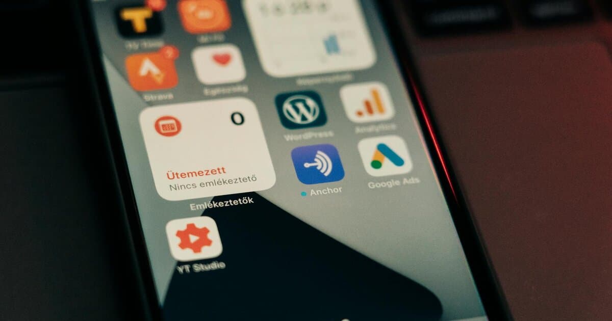 Close-up view of smartphone screen featuring various app icons and notifications.