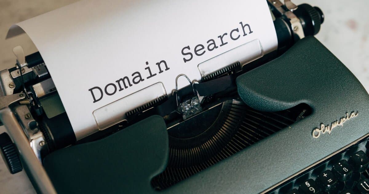 Close-up of a vintage typewriter with paper displaying 'Domain Search' text for conceptual design.