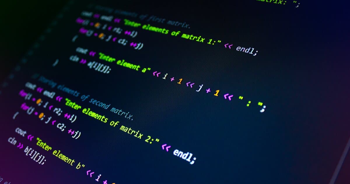 Close-up of colorful programming code displayed on a monitor screen.
