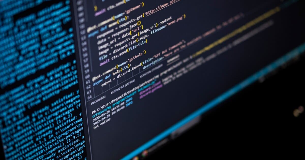 Close-up of a computer screen displaying HTML, CSS, and JavaScript code