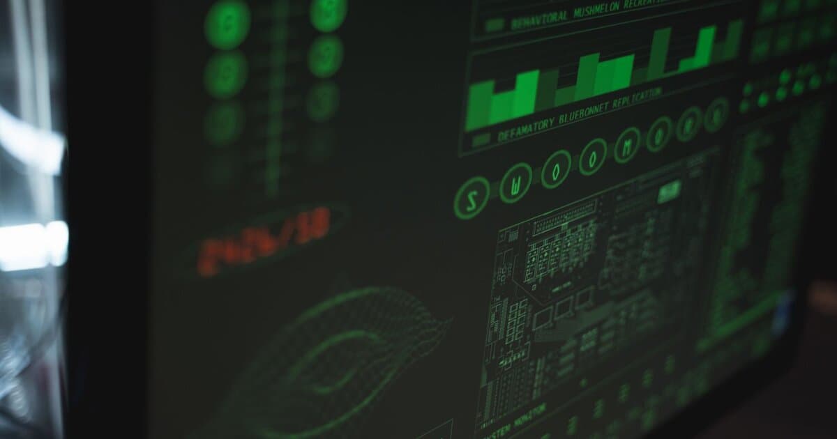 Close-up view of a computer displaying cybersecurity and data protection interfaces in green tones.